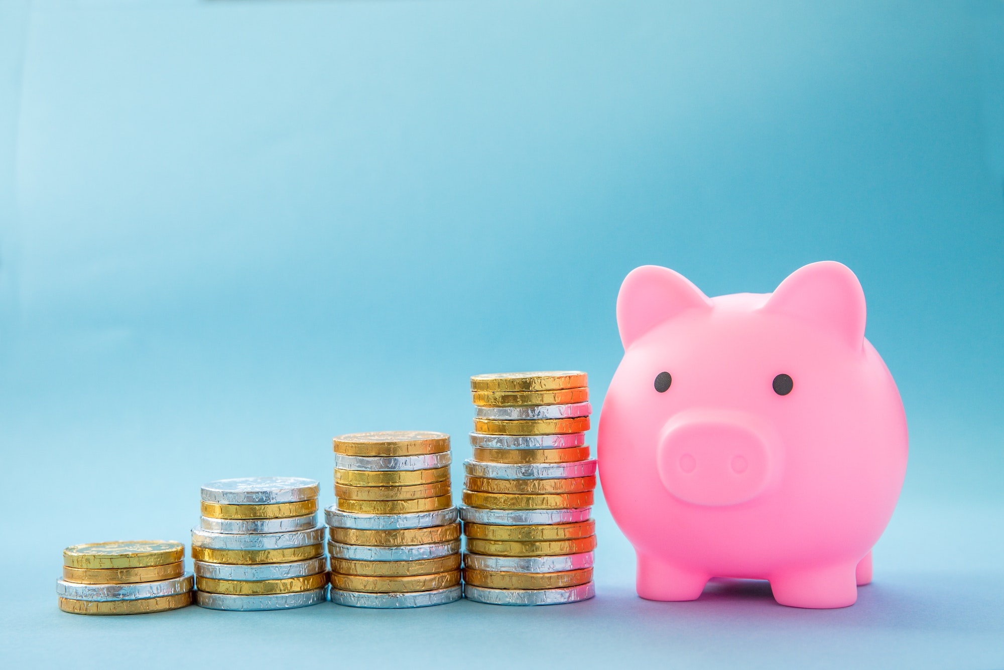 A Home finance or children savings scheme concept showing upwards financial growth with coins