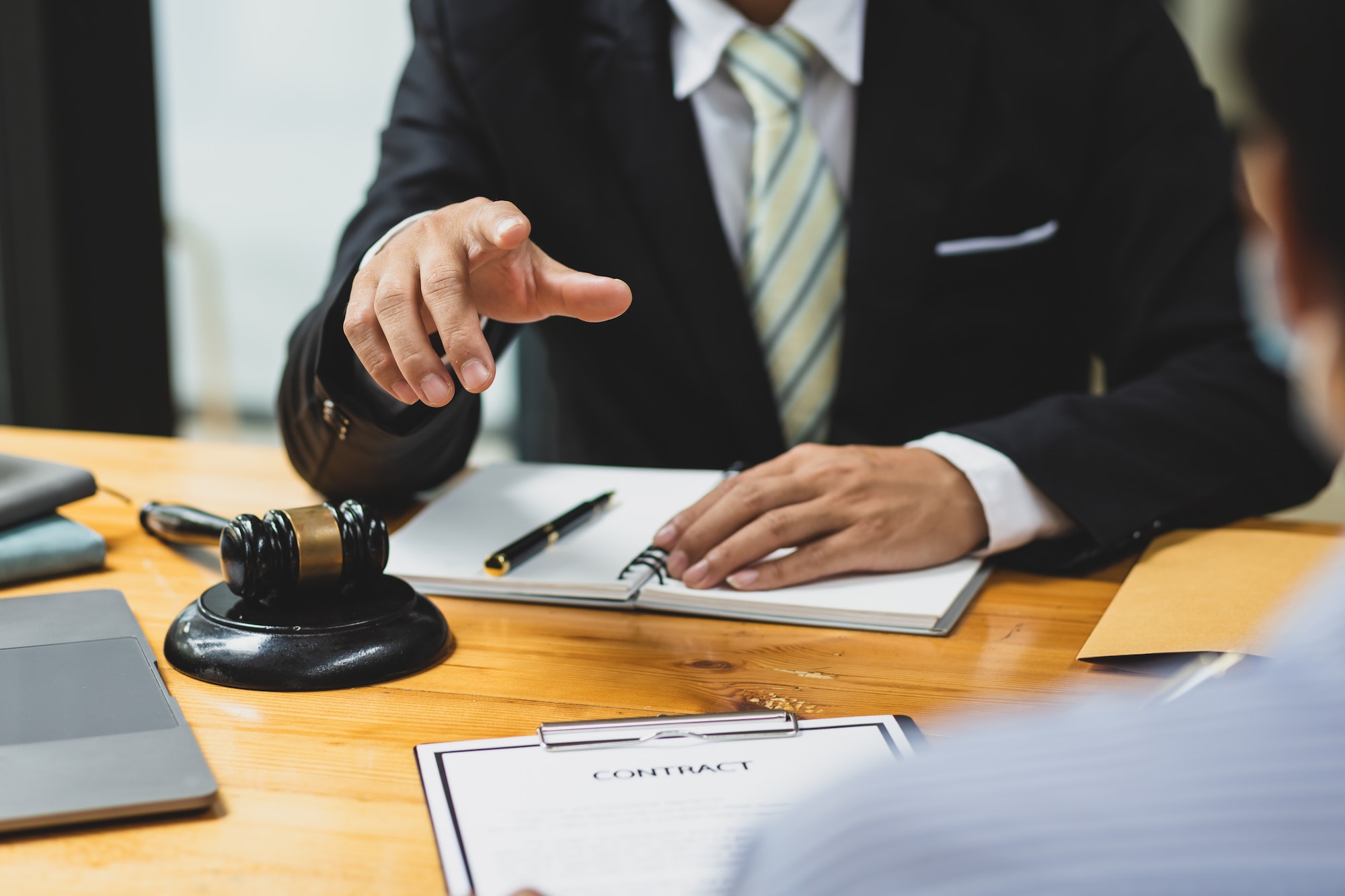 Lawyer, contract agreements document and legal proceedings.